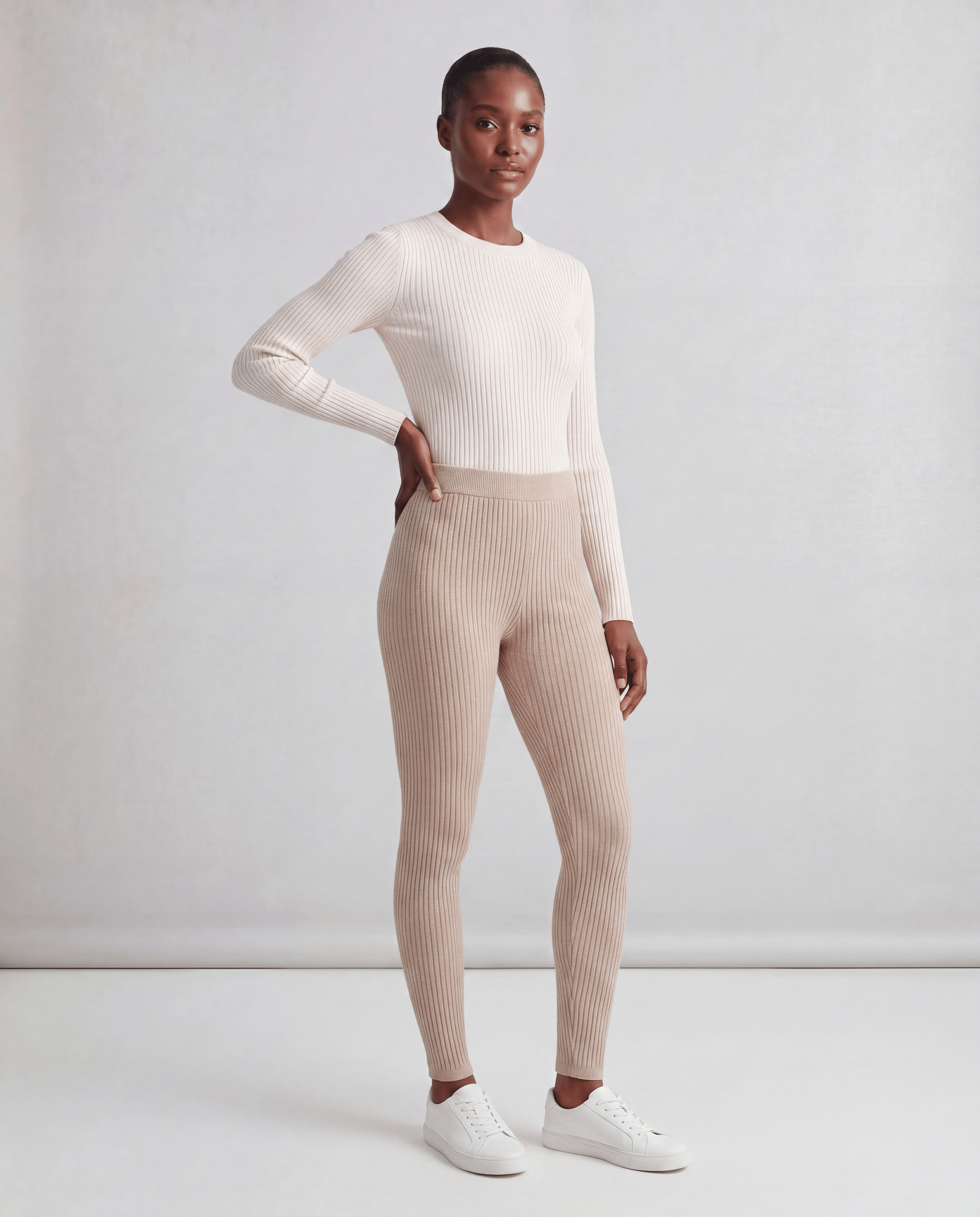 Black ribbed slim fit leggings by ROMAR featuring a stretchy, textured fabric design for comfortable everyday wear.