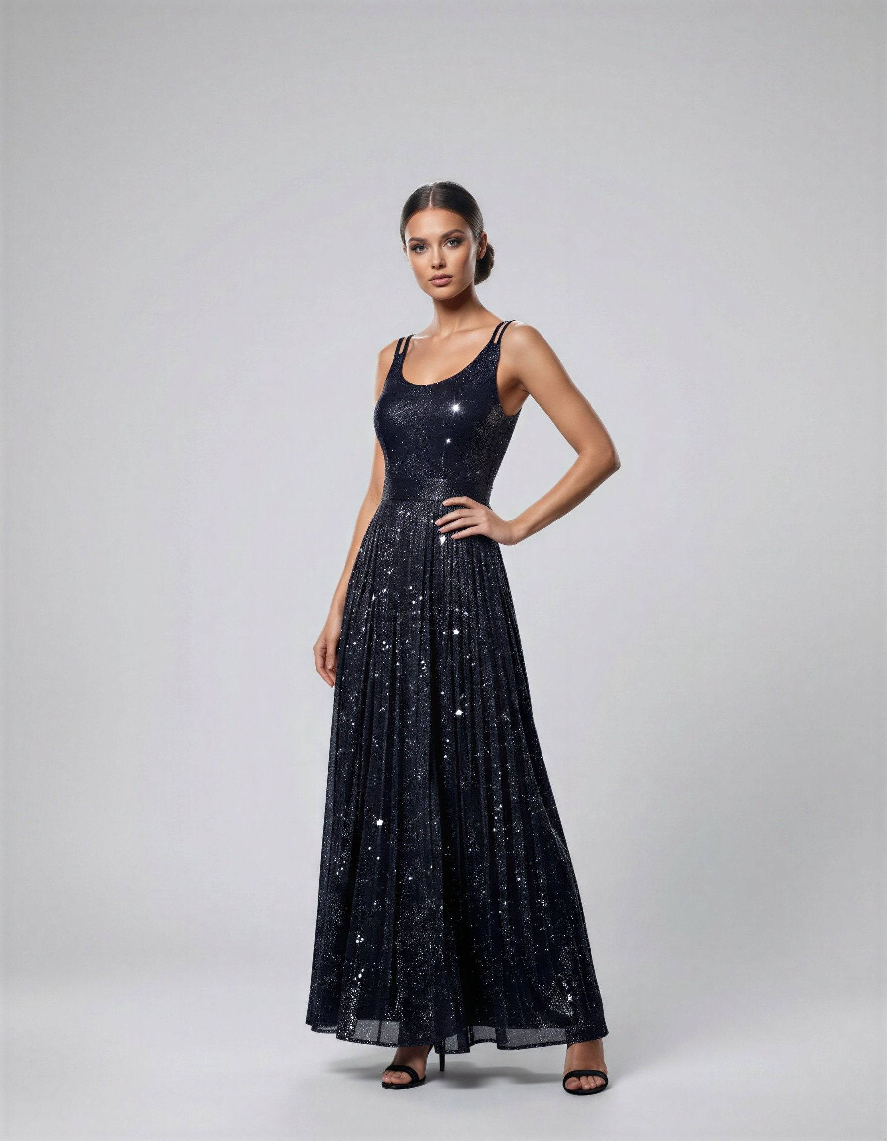 ROMAR glitter scoop neck maxi dress with double straps, flowing fabric, and sparkling finish, perfect for elegant occasions.