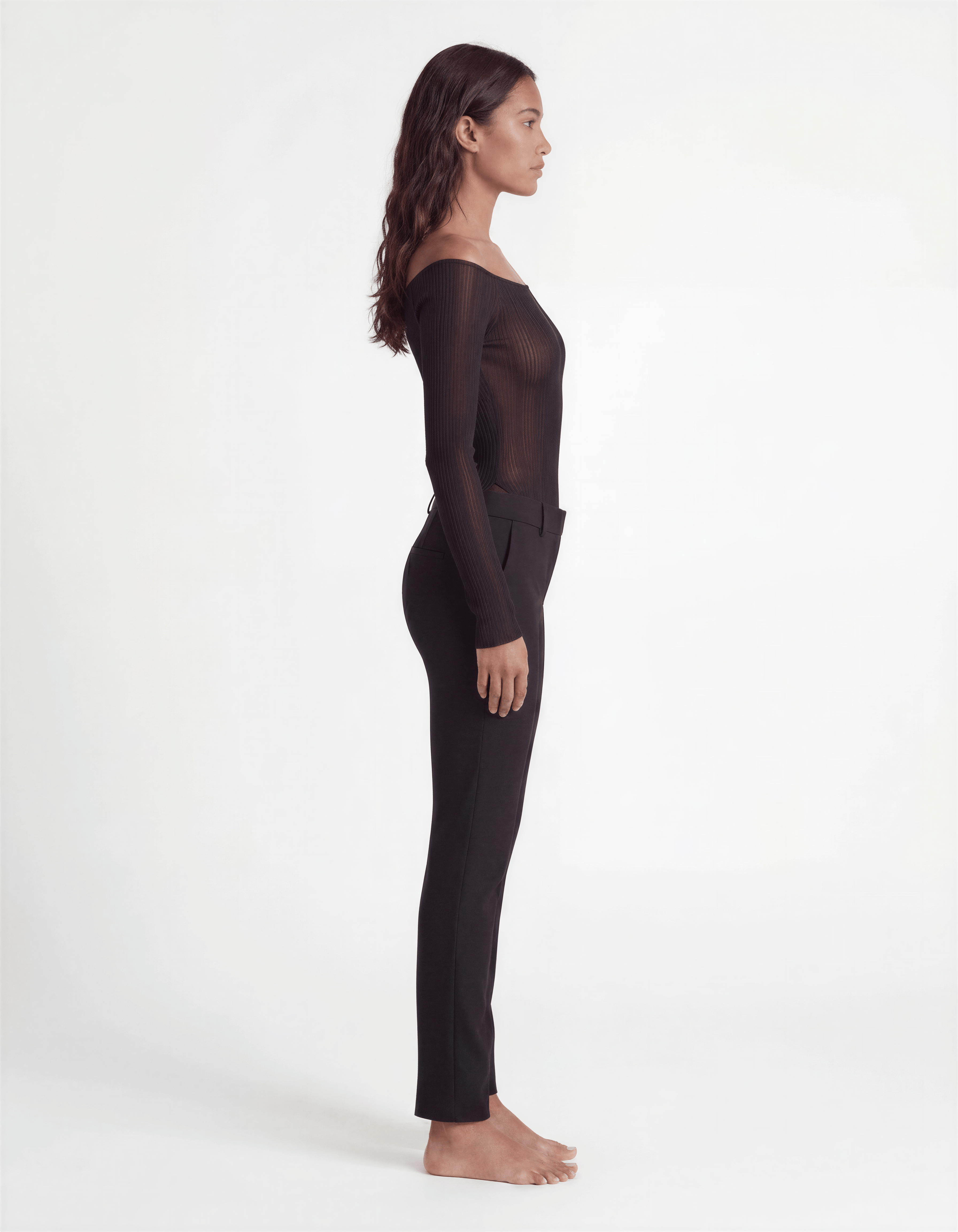 Pink ribbed off-shoulder longline top by ROMAR, featuring fitted long sleeves and a stylish off-shoulder neckline.
