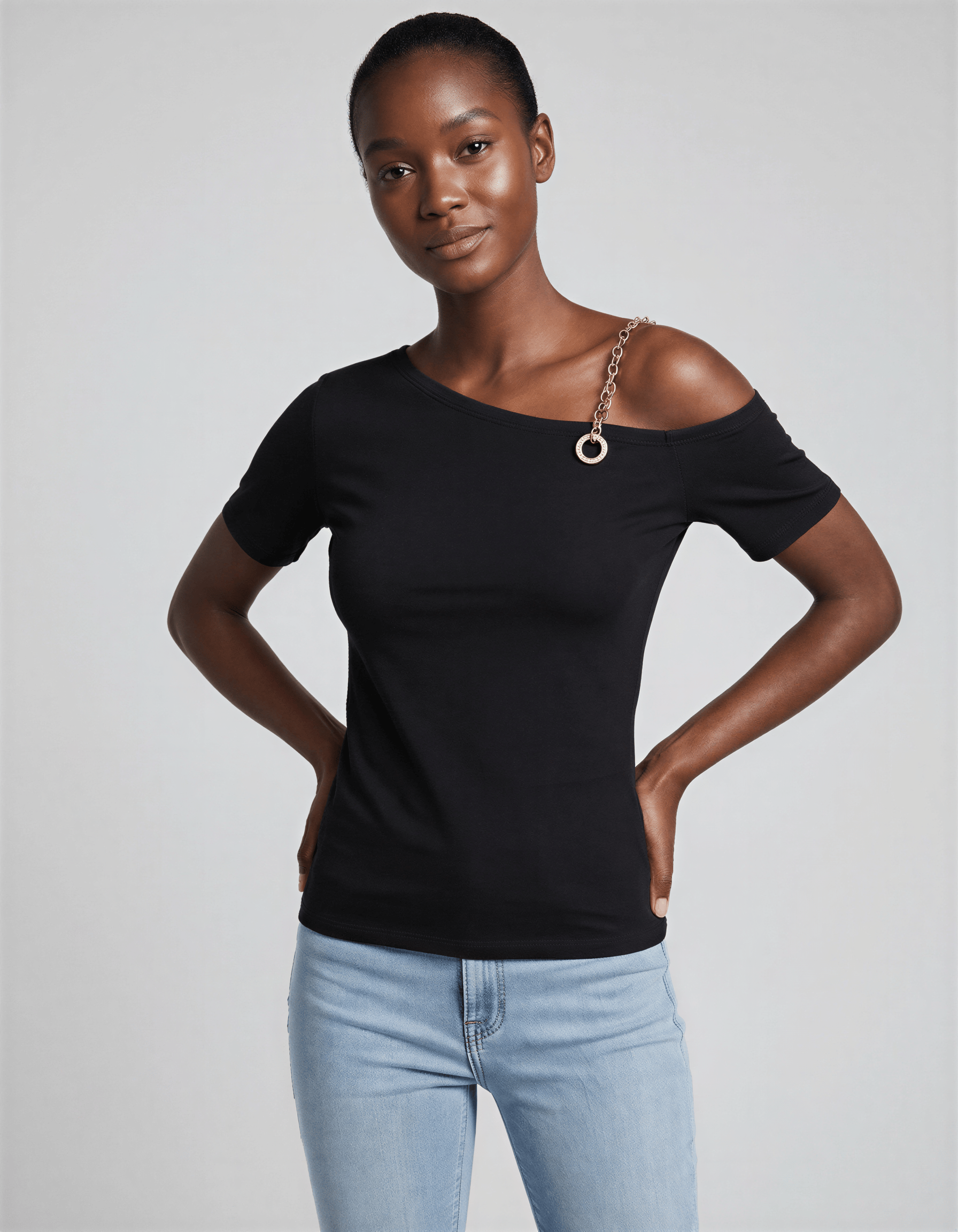 ROMAR one-shoulder short sleeve top featuring chain and crystal ring details, showcasing stylish fashion with elegant accessories.