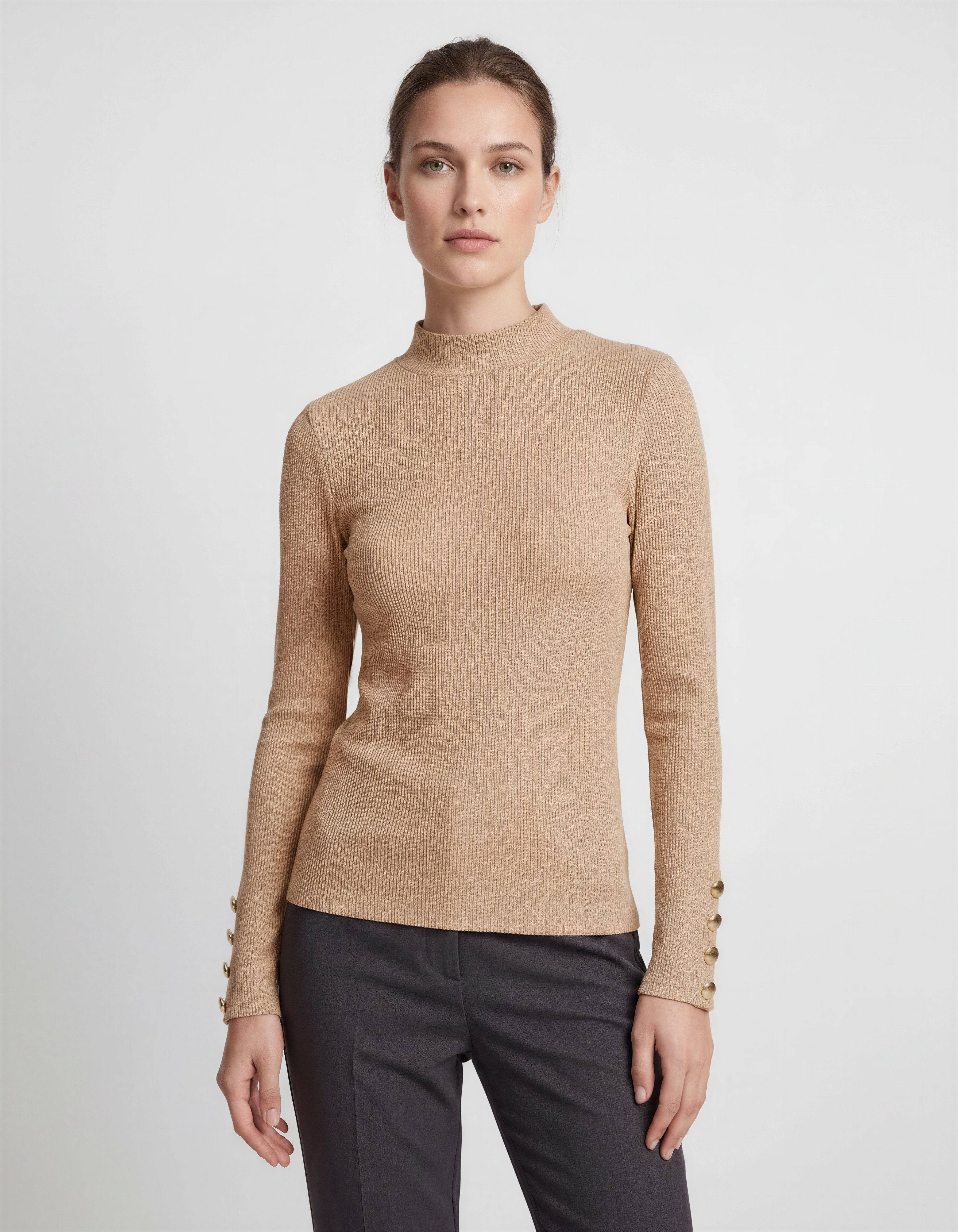 ROMAR ribbed mock neck top with gold button cuffs, shown in a close-up image highlighting the textured fabric and stylish details.