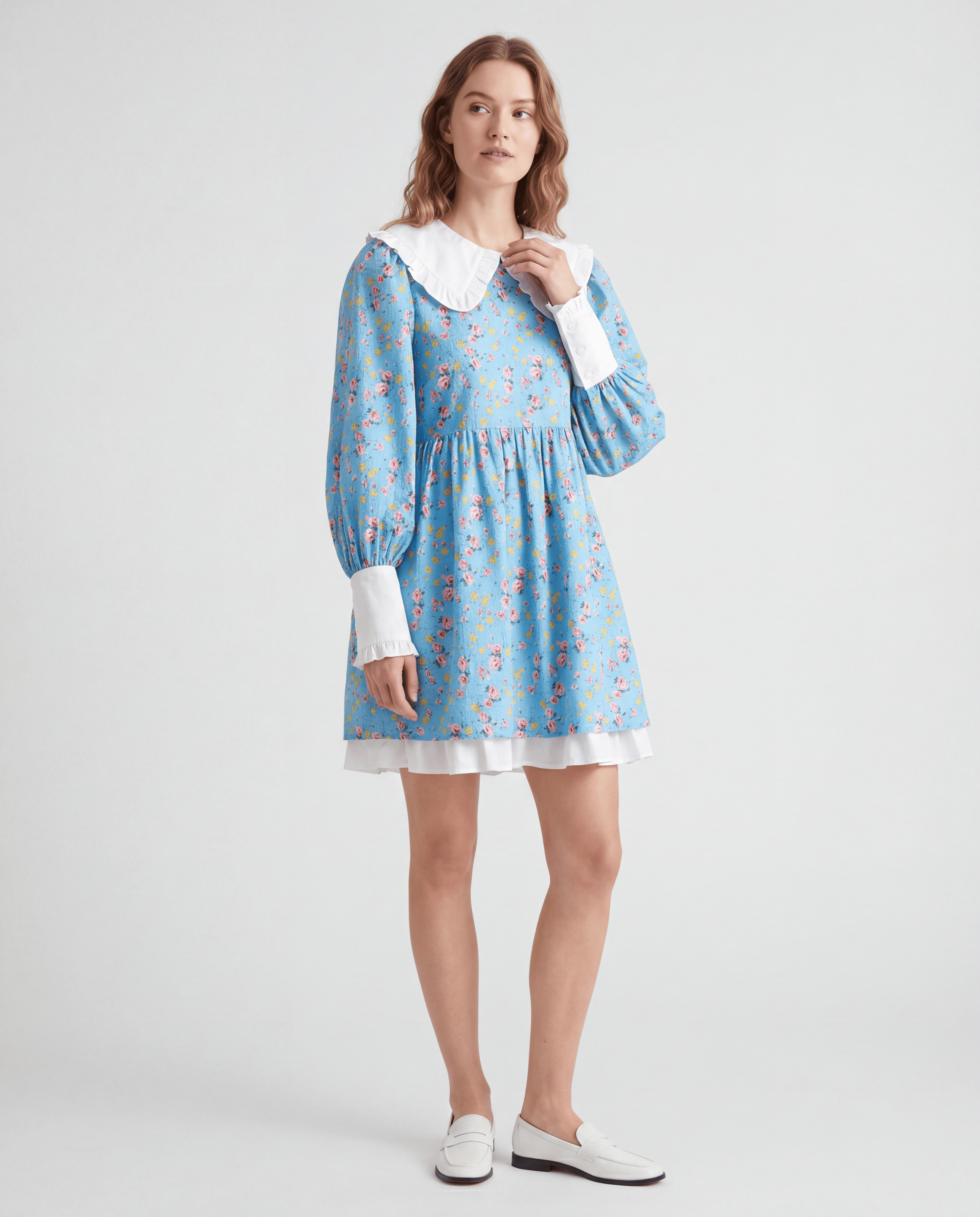 ROMAR floral ruffle babydoll mini dress with Peter Pan collar, featuring a delicate floral pattern and ruffled neckline.