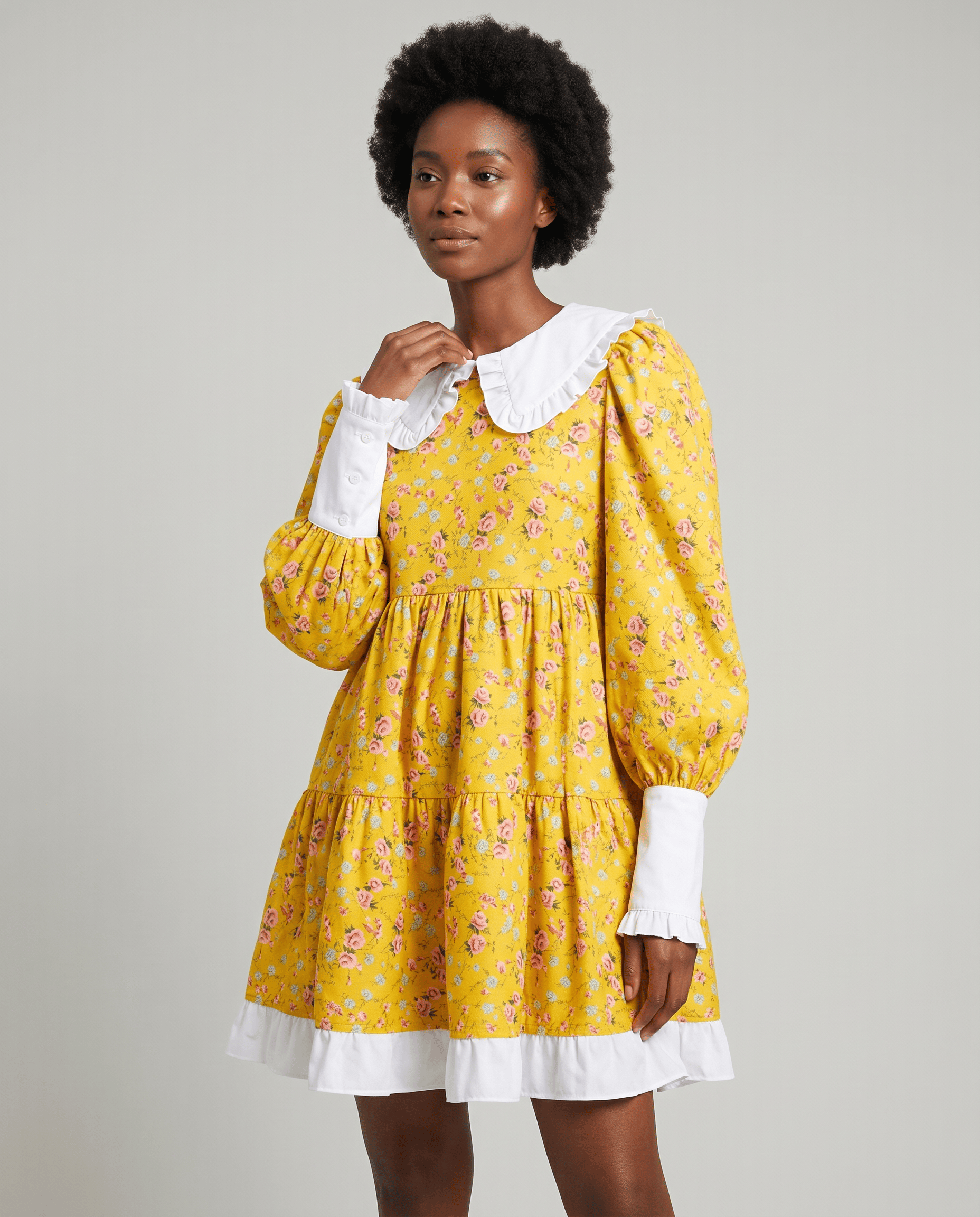 Romar floral ruffle Peter Pan collar babydoll mini dress with delicate floral print and feminine ruffle details.