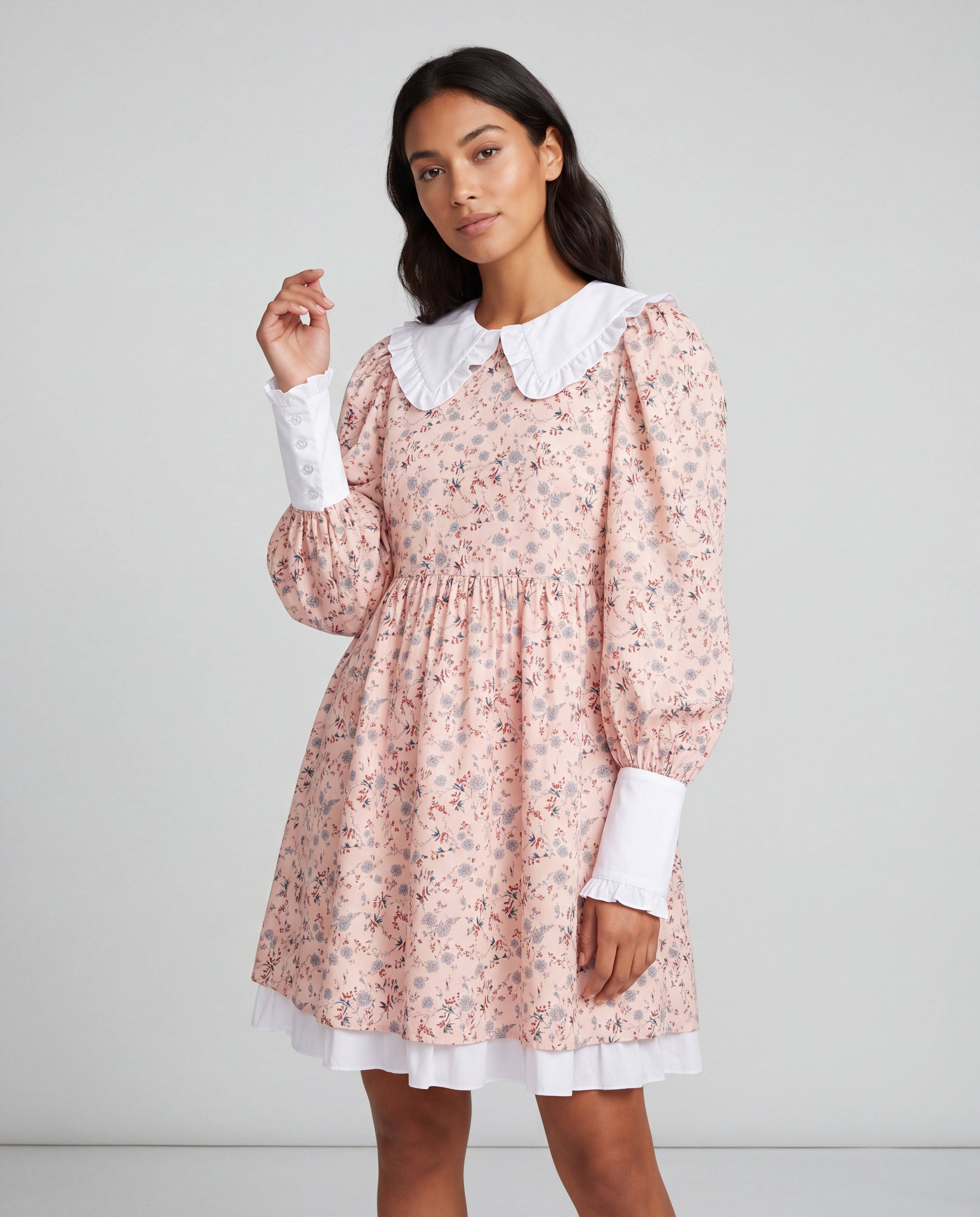 ROMAR floral ruffle Peter Pan collar babydoll mini dress displayed on a hanger with detailed floral and ruffle accents.