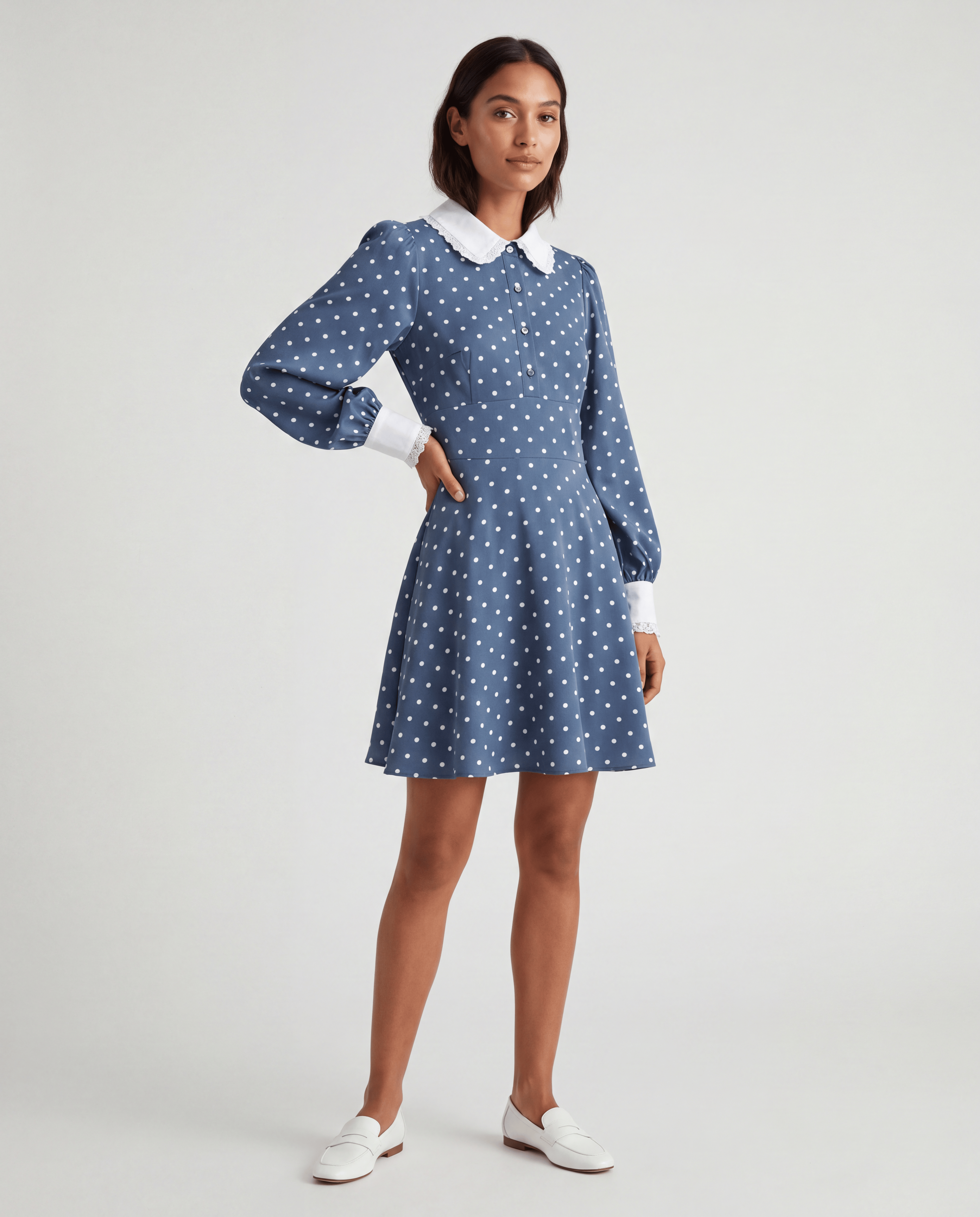 ROMAR Polka Dot Peter Pan Collar Mini Dress featuring a playful pattern and classic collar, perfect for stylish daytime wear.