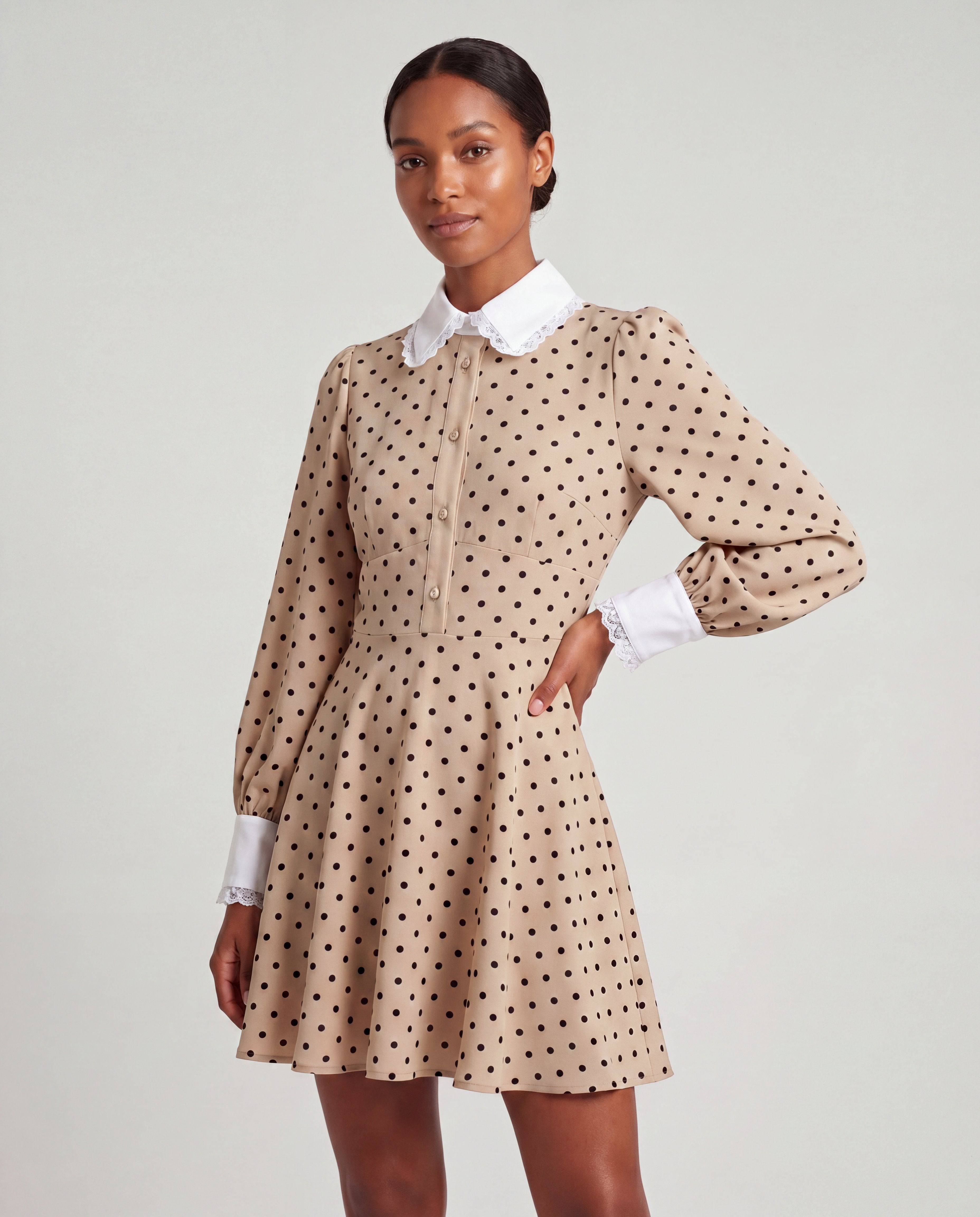 ROMAR polka dot Peter Pan collar mini dress featuring a playful, vintage-inspired design with a fitted waist and flared skirt.