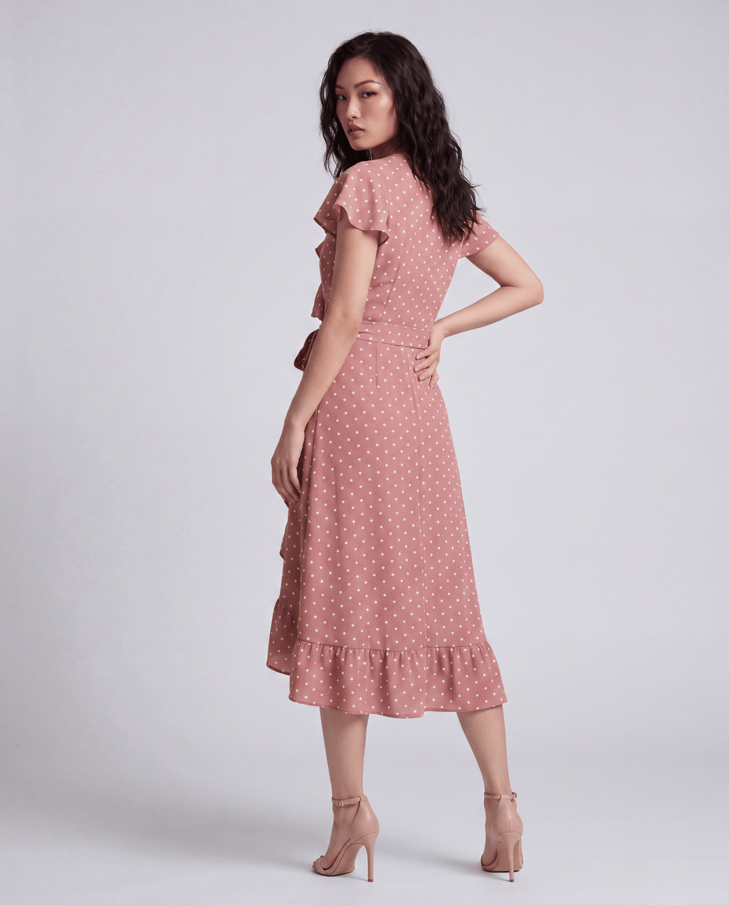 ROMAR printed ruffle wrap midi dress with floral pattern, featuring ruffled sleeves and a fitted waist on a model.