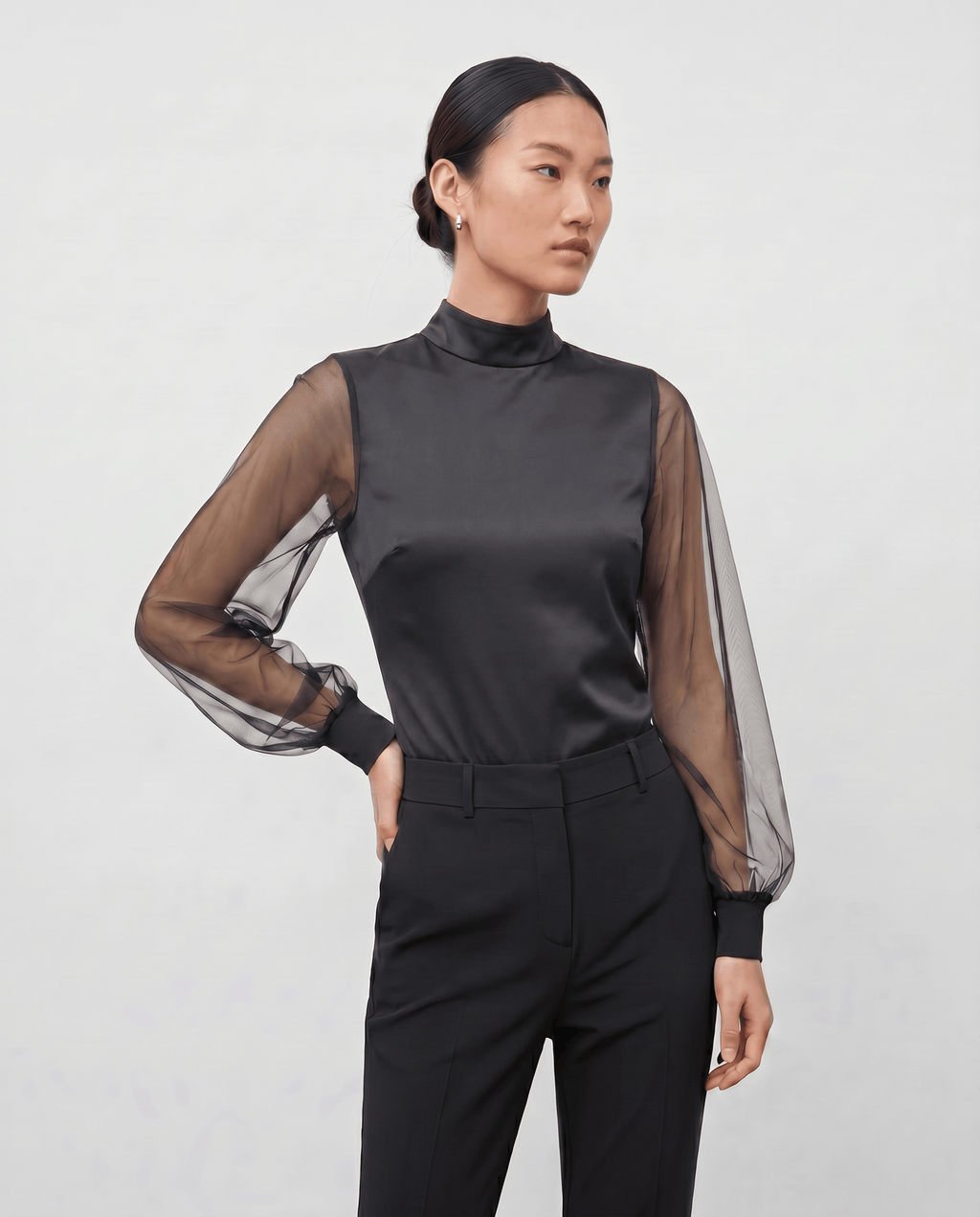 ROMAR high neck ruffle mesh sleeve bodysuit with zip back, featuring stylish ruffle details and fitted design.
