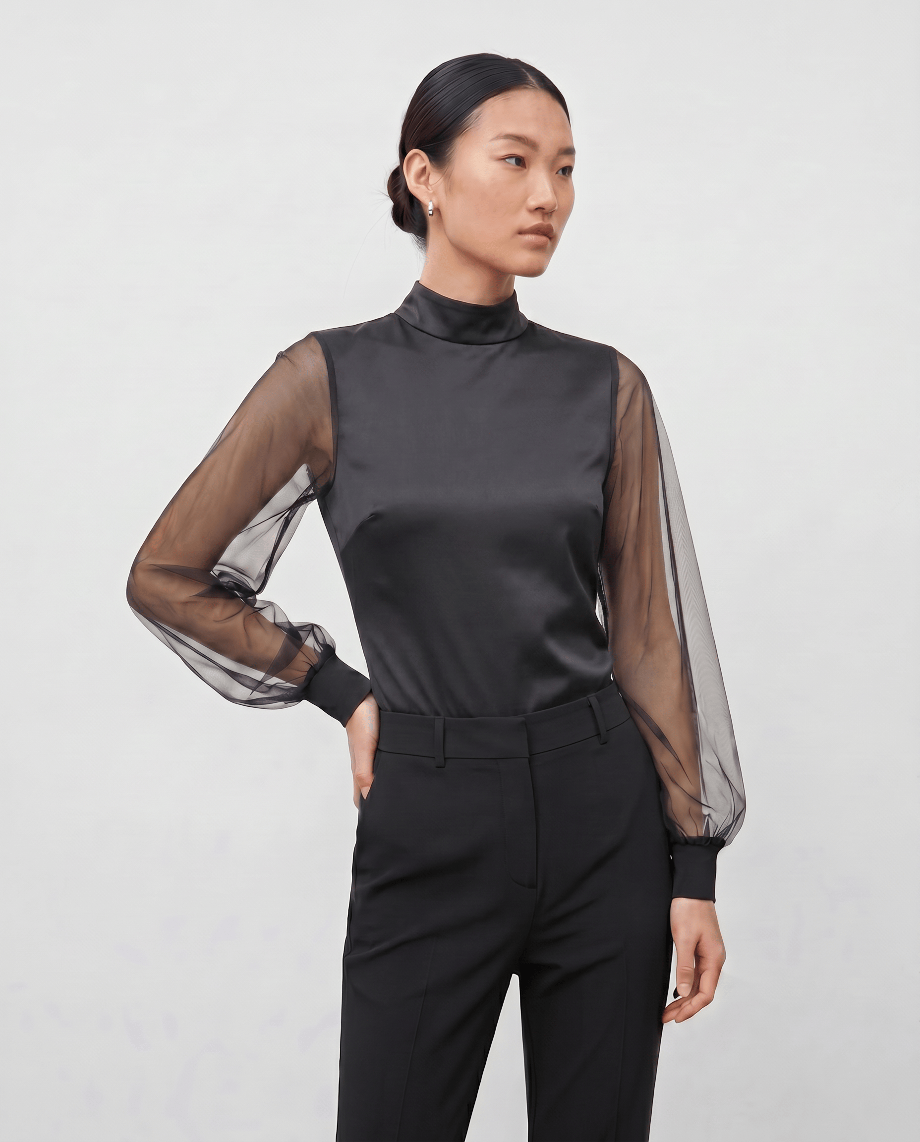 ROMAR high neck ruffle mesh sleeve bodysuit with zip back, featuring stylish ruffle details and fitted design.
