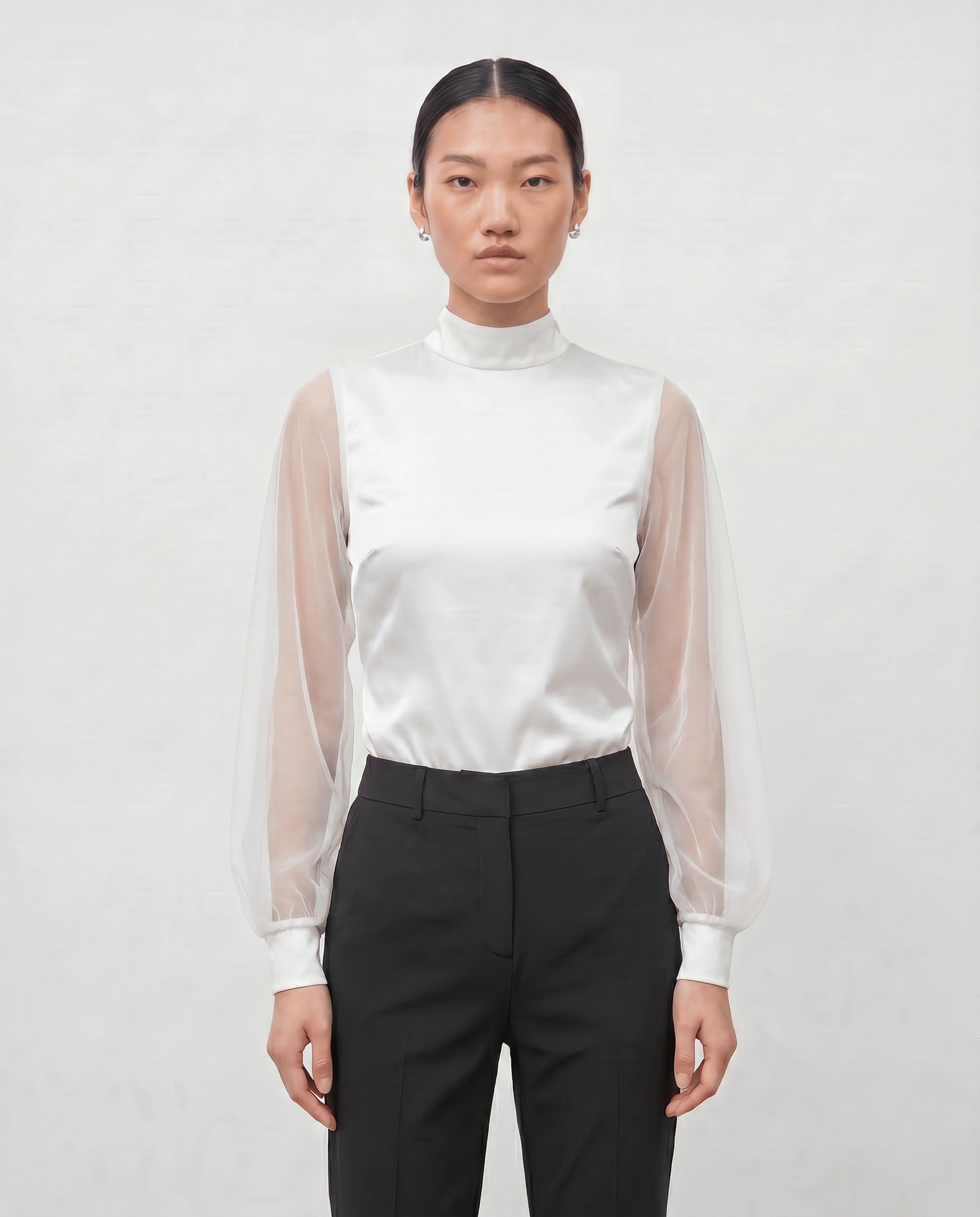 ROMAR high neck ruffle mesh sleeve bodysuit with zip back, showing the elegant neckline and detailed ruffle design.