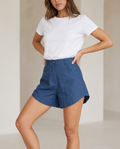 High waist tailored chambray shorts by ROMAR, featuring a fitted design and classic blue fabric, perfect for casual summer wear.
