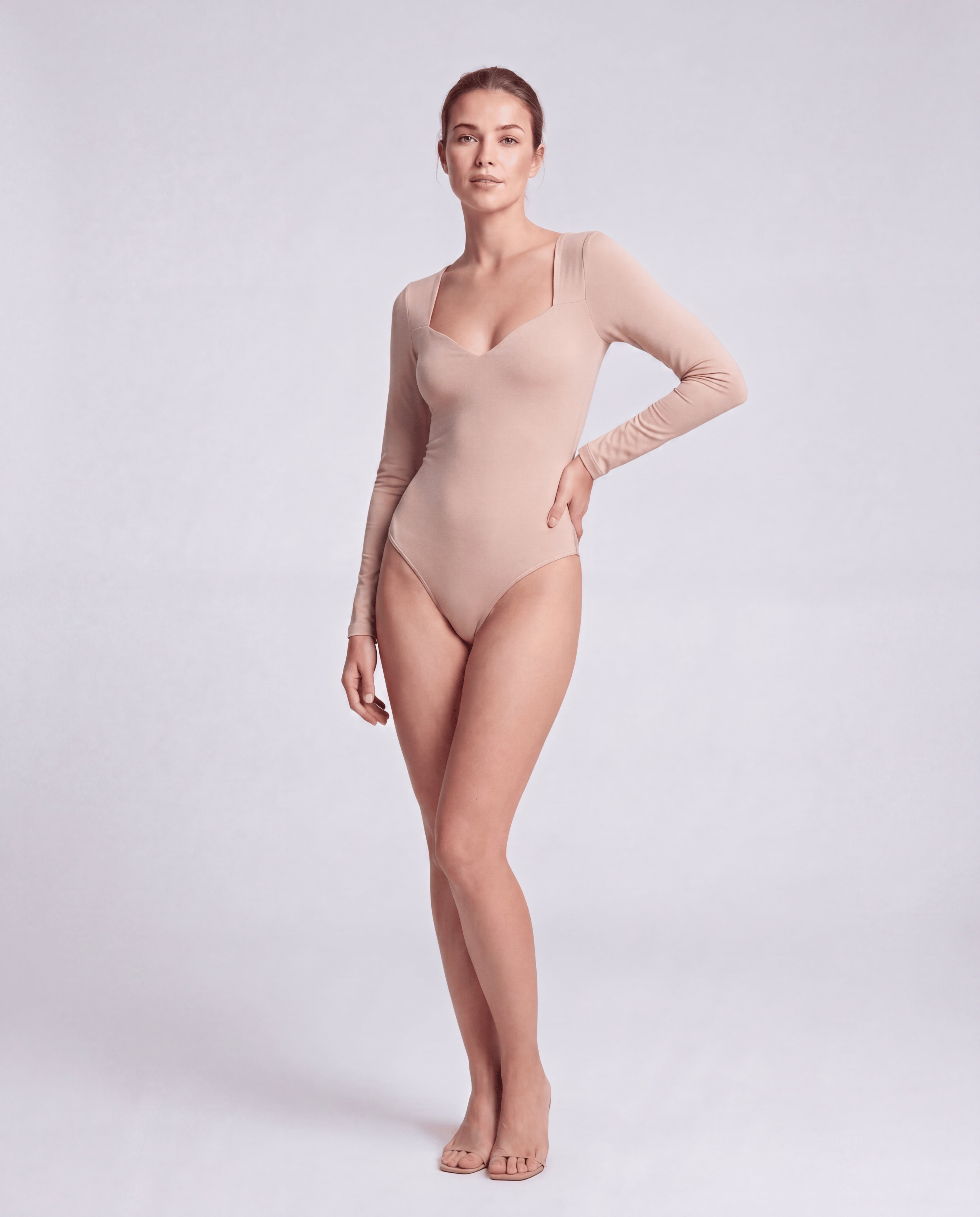 ROMAR V-neck long sleeve bodysuit shown in black, featuring a fitted design and seamless fabric for a sleek, stylish look.