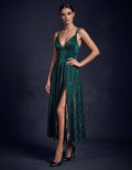 ROMAR glitter midi dress with a slit, featuring sparkly fabric and a fitted silhouette, perfect for evening events.