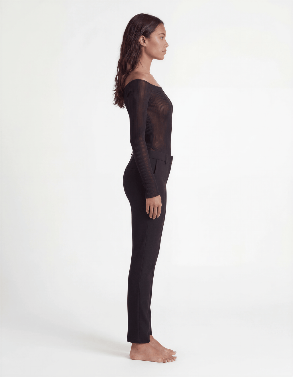 Pink ribbed off-shoulder longline top by ROMAR, featuring fitted long sleeves and a stylish off-shoulder neckline.
