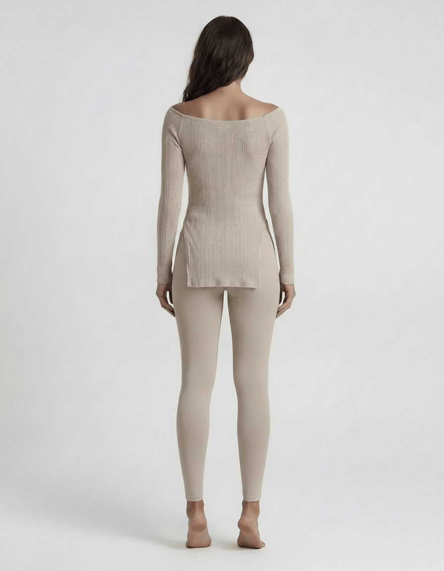 ROMAR ribbed off-shoulder longline top displayed on a mannequin, featuring a fitted design and longline style in a soft fabric.