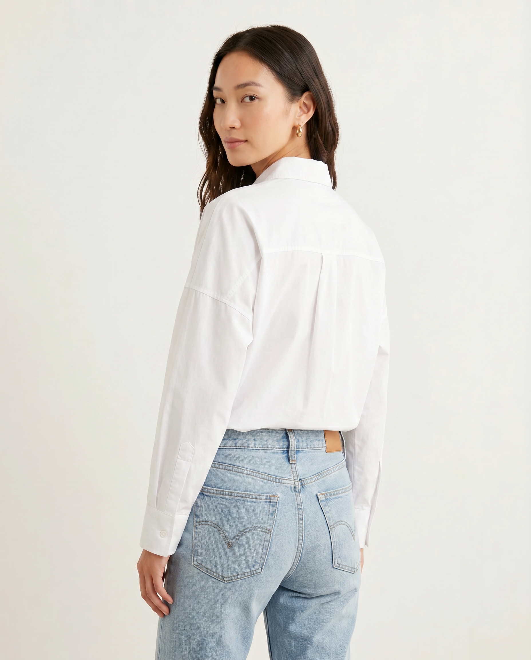 ROMAR Atelier oversized cotton shirt, casual long-sleeve tops with a relaxed fit, soft white fabric, and classic collar.